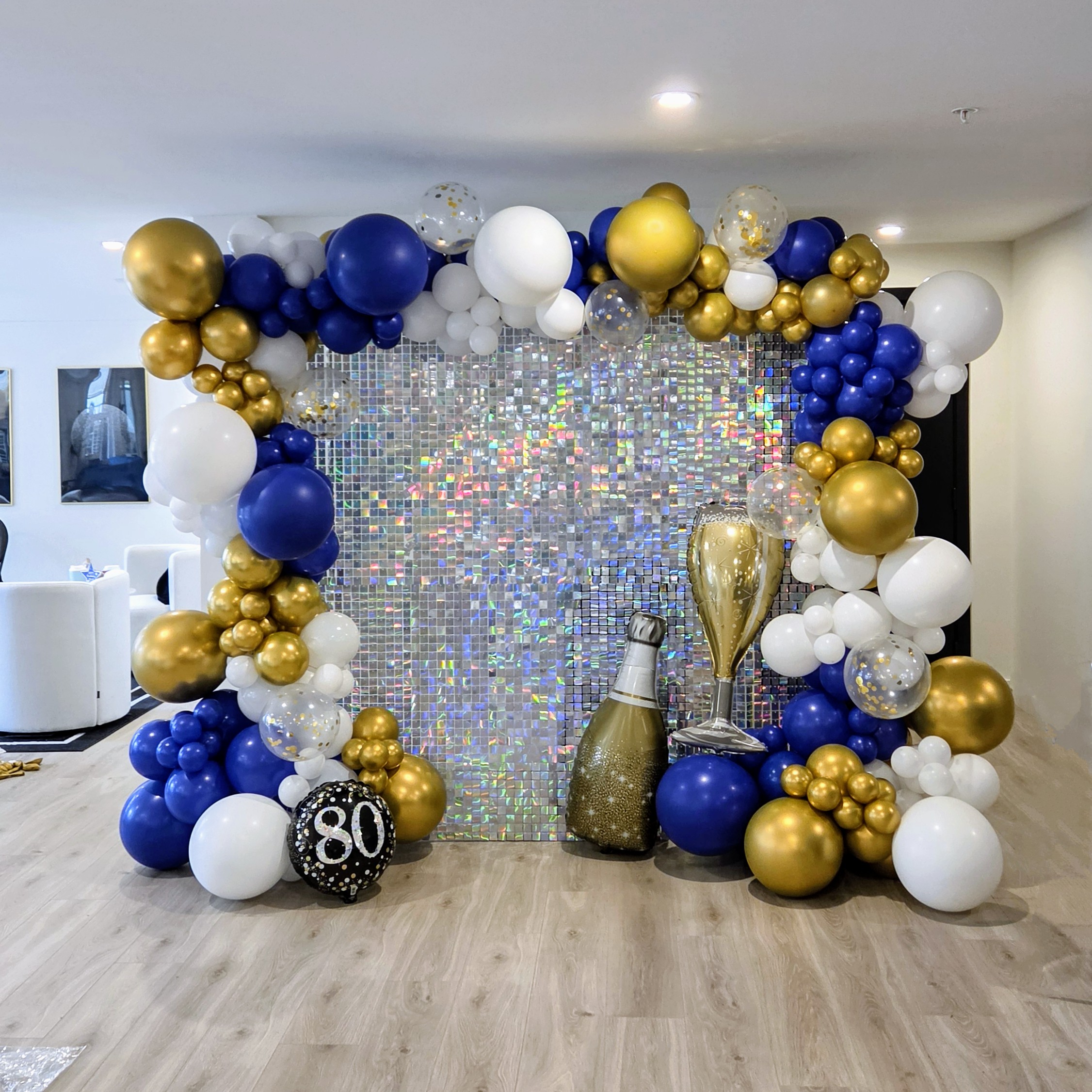 80th birthday balloon arch with shimmer wall