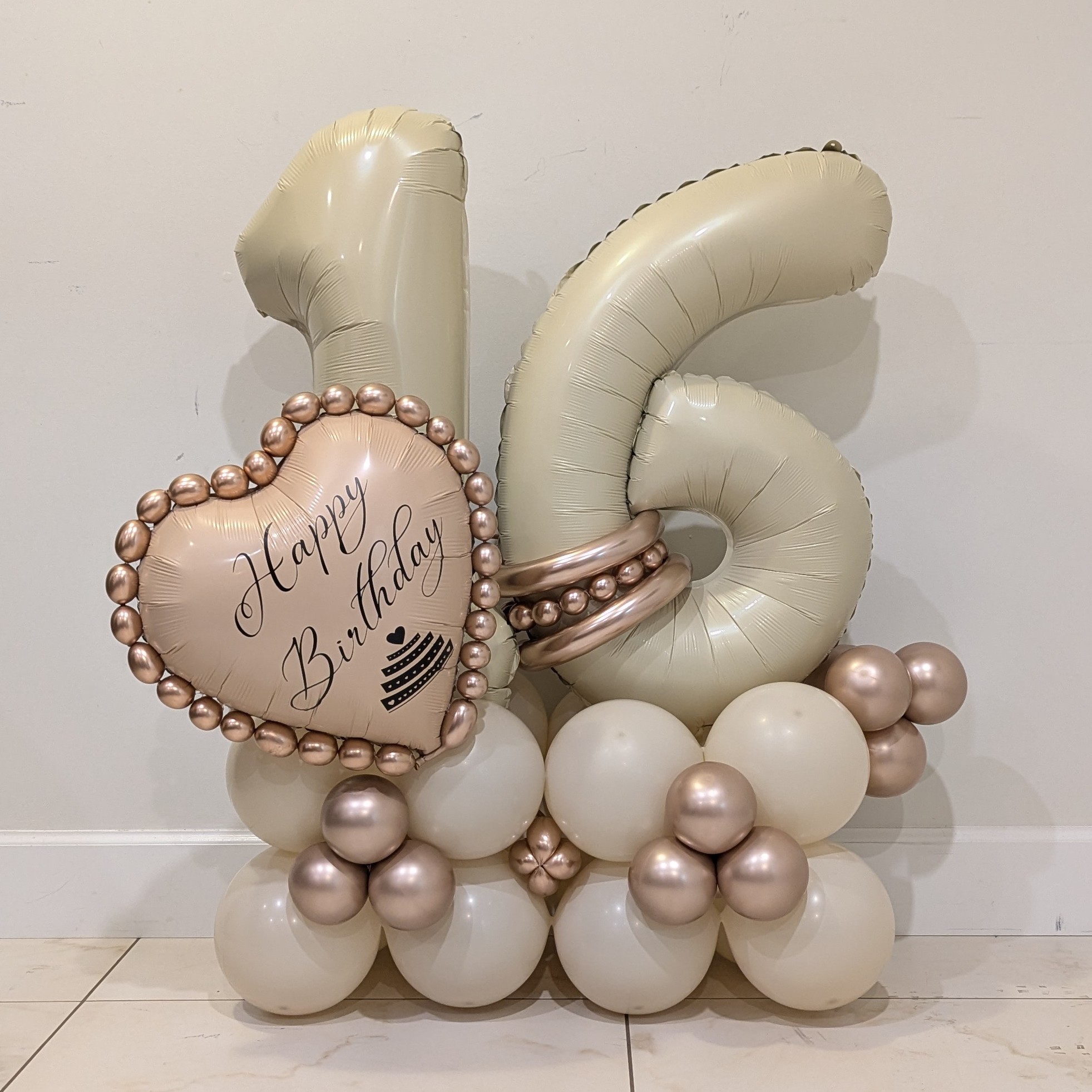 Sweet 16 cream and rose gold balloon bouquet