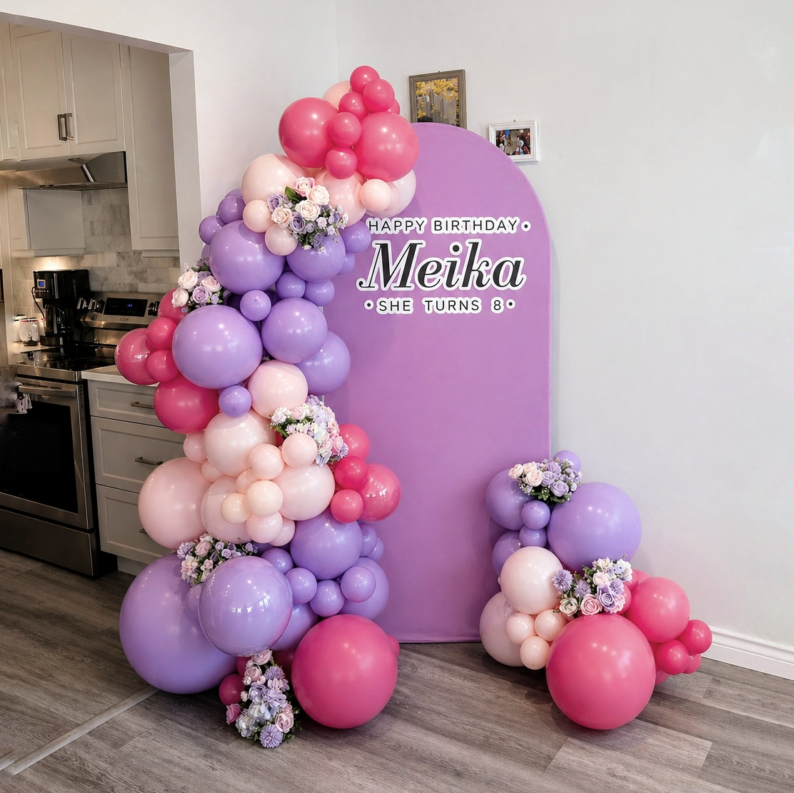 Purple pink balloon arch with florals for Meika's 8th birthday